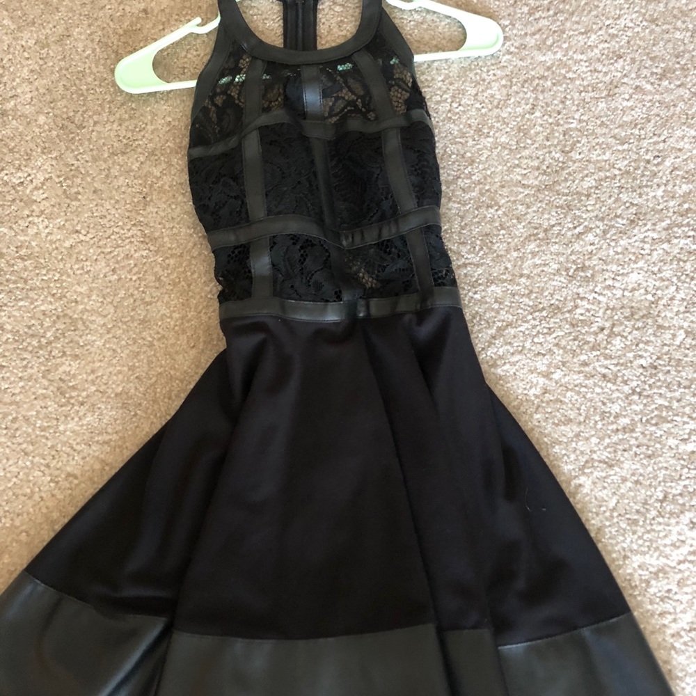 Black short dress with leather boning.
